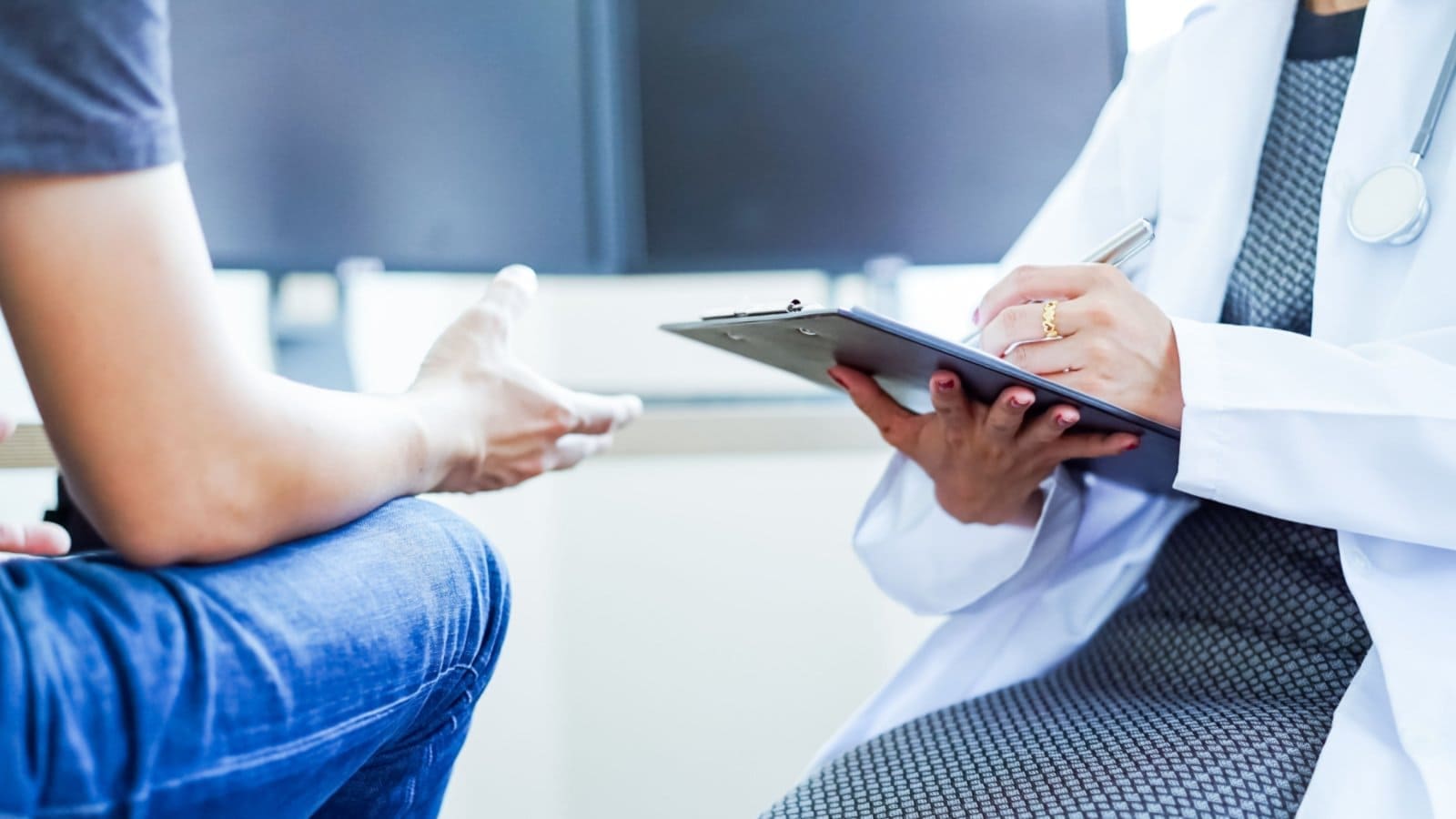 Female doctor and a male patient during a check-up