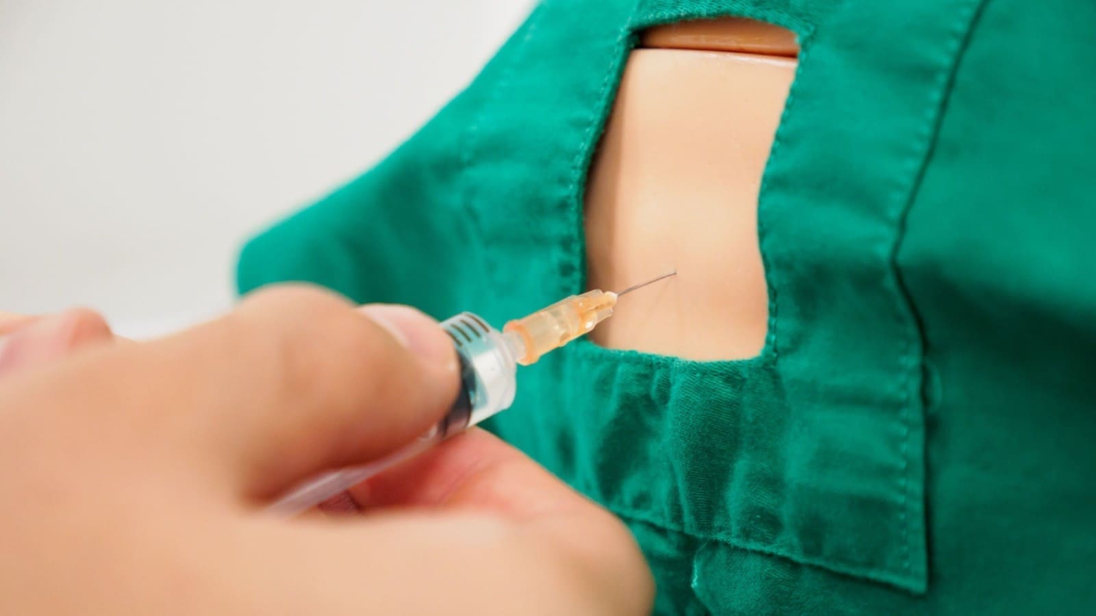 Physician doing a spinal tap on a patient